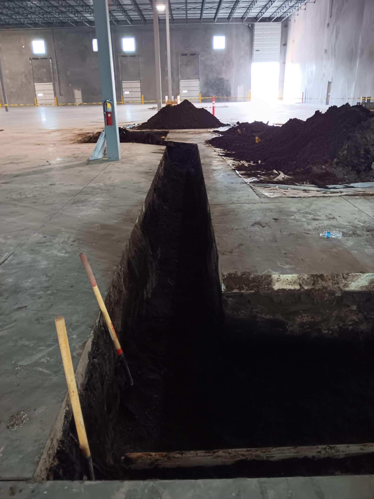 Interior trench excavation — Tilt-wall warehouse